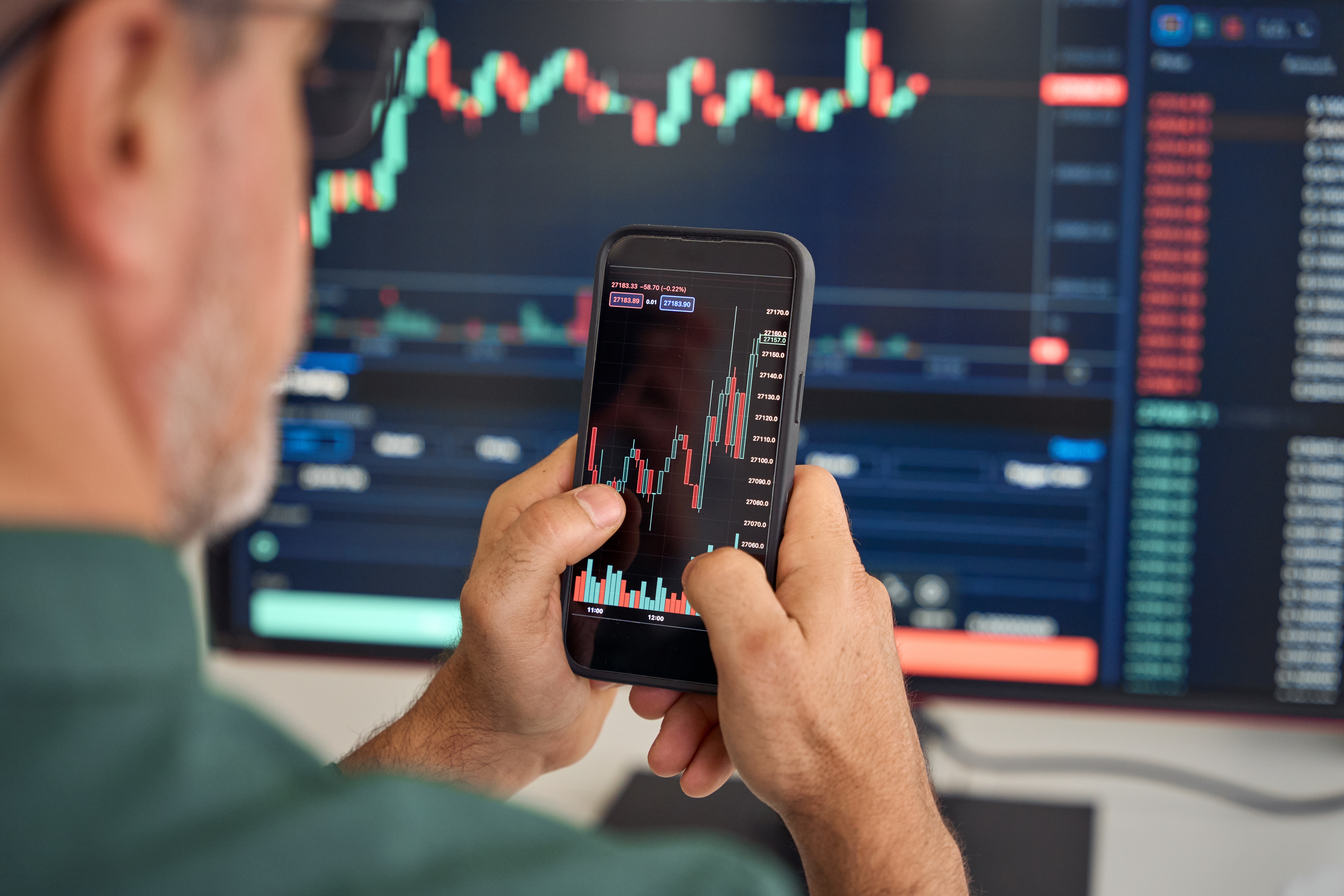 Investor trader broker analyzing financial crypto stock trade market on smartphone risk digital price data in mobile app buying bank shares, doing investment